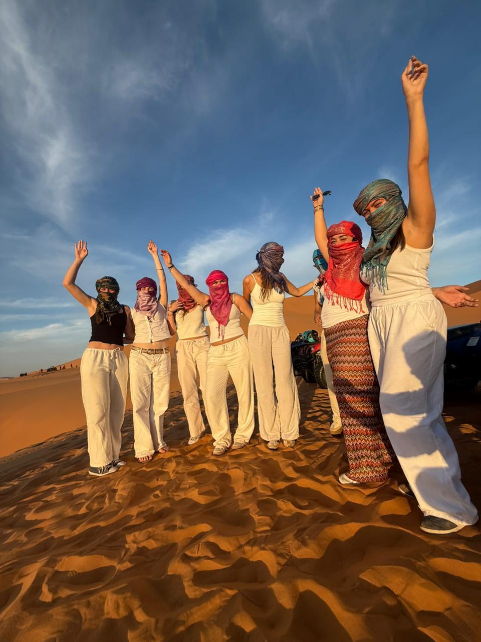 Berber musicians playing drums by the campfire