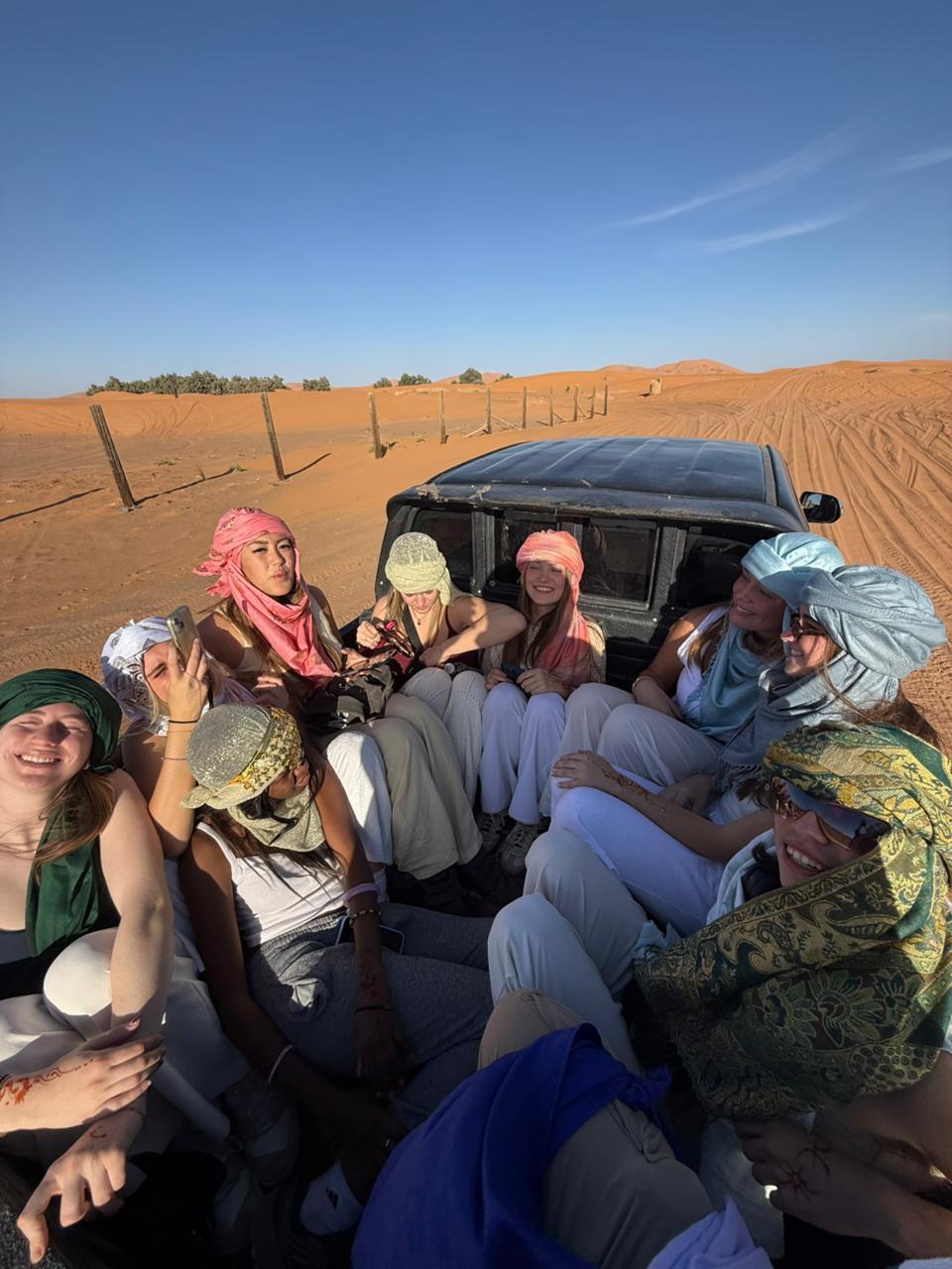 Students in 4x4 crossing the dunes