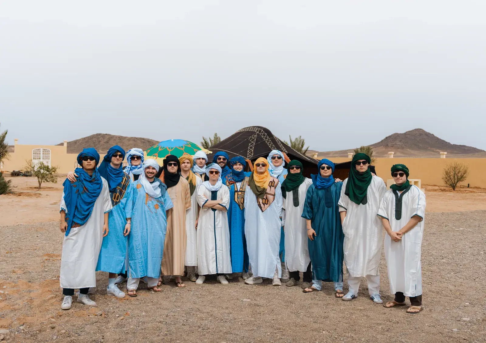 Students in traditional Berber tunics at the desert camp