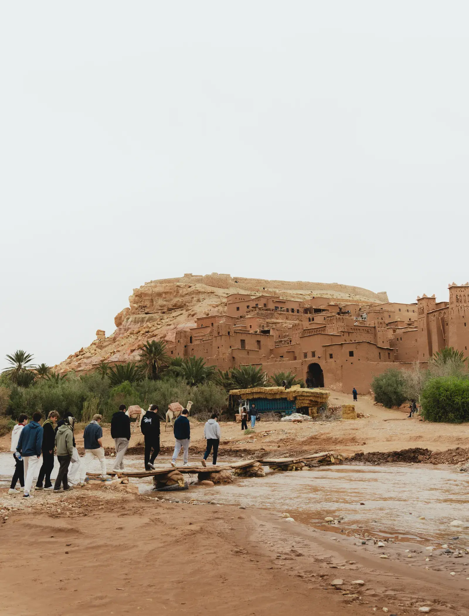 Students walking towards Ait Ben Haddou across the river